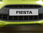 Original Ford Fiesta Difusor de paragolpes delantero en color negro.