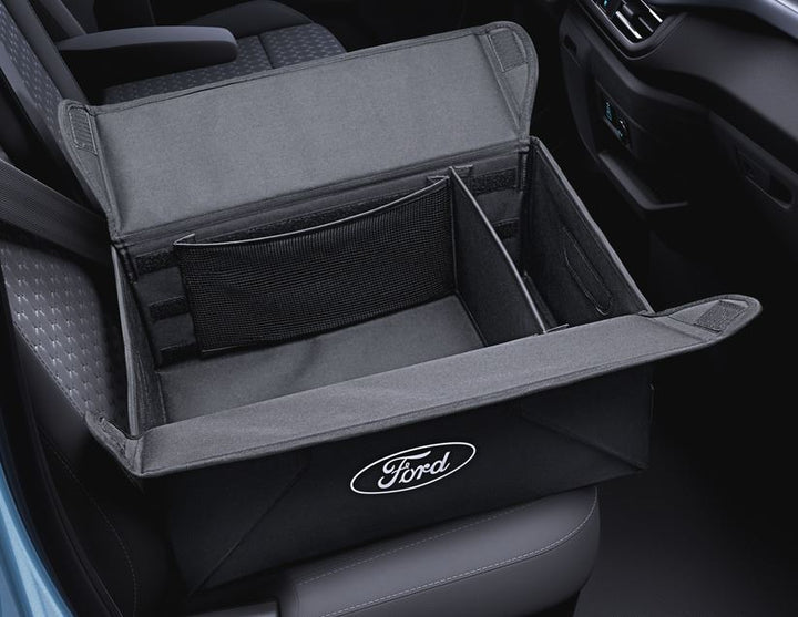 Caja organizadora plegable de tela en color negro, con óvalo Ford en color blanco a ambos lados.