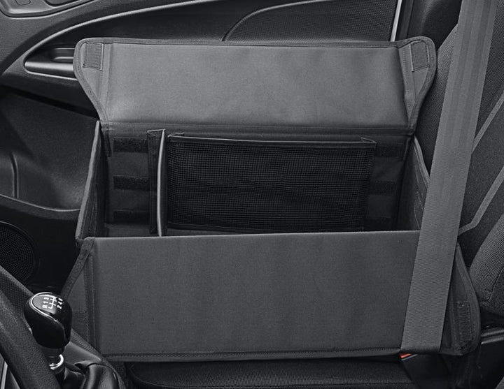 Caja organizadora plegable de tela en color negro, con óvalo Ford en color blanco a ambos lados.