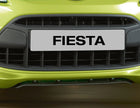 Original Ford Fiesta Difusor de paragolpes delantero en color negro.